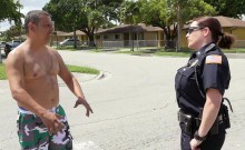 Blonde female police offer sucks a black dick in the street